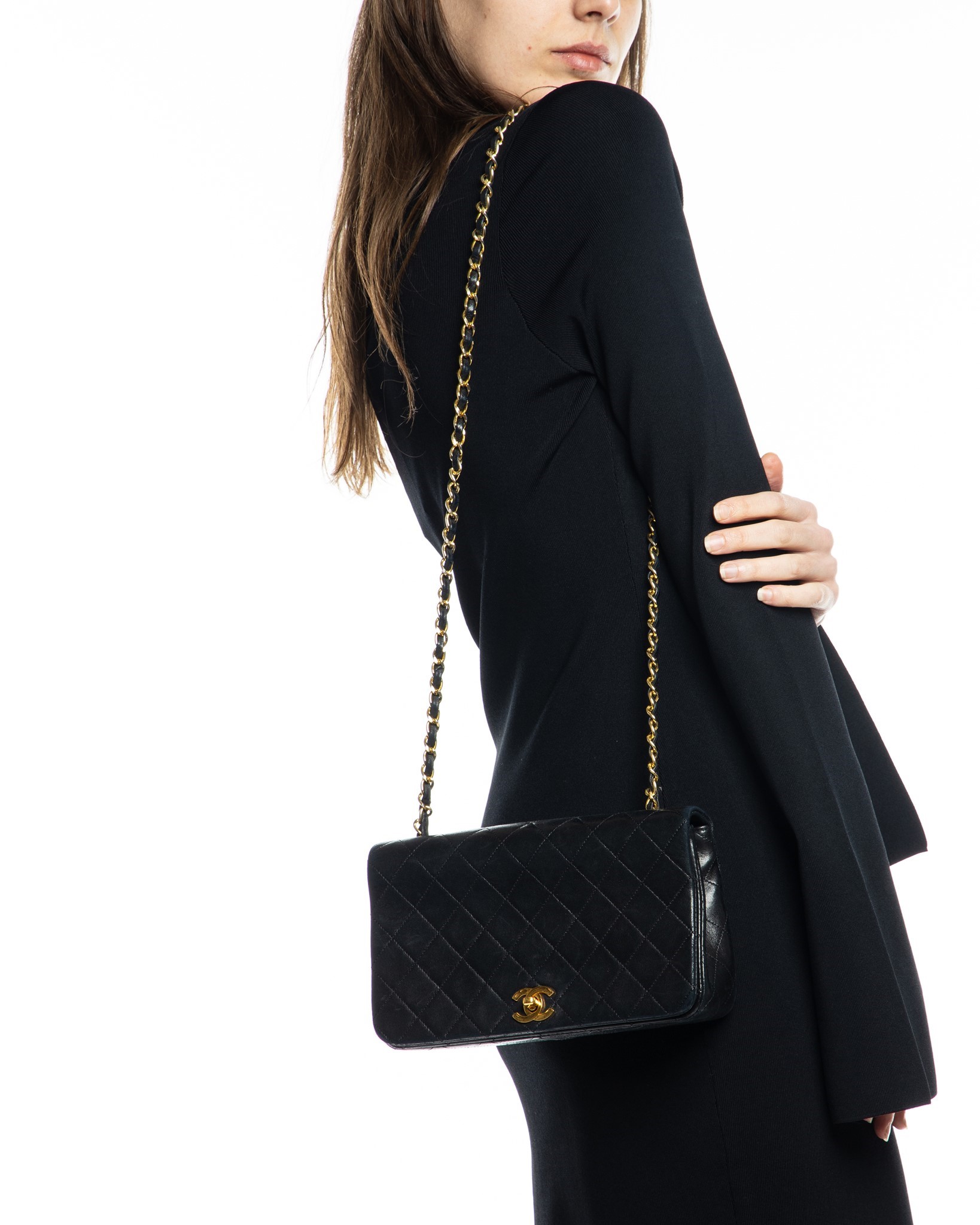 Nass boutique is a multi-brand boutique curating women's clothing and  accessoriesVINTAGE CHANEL BLACK QUILTED FLAP BAG