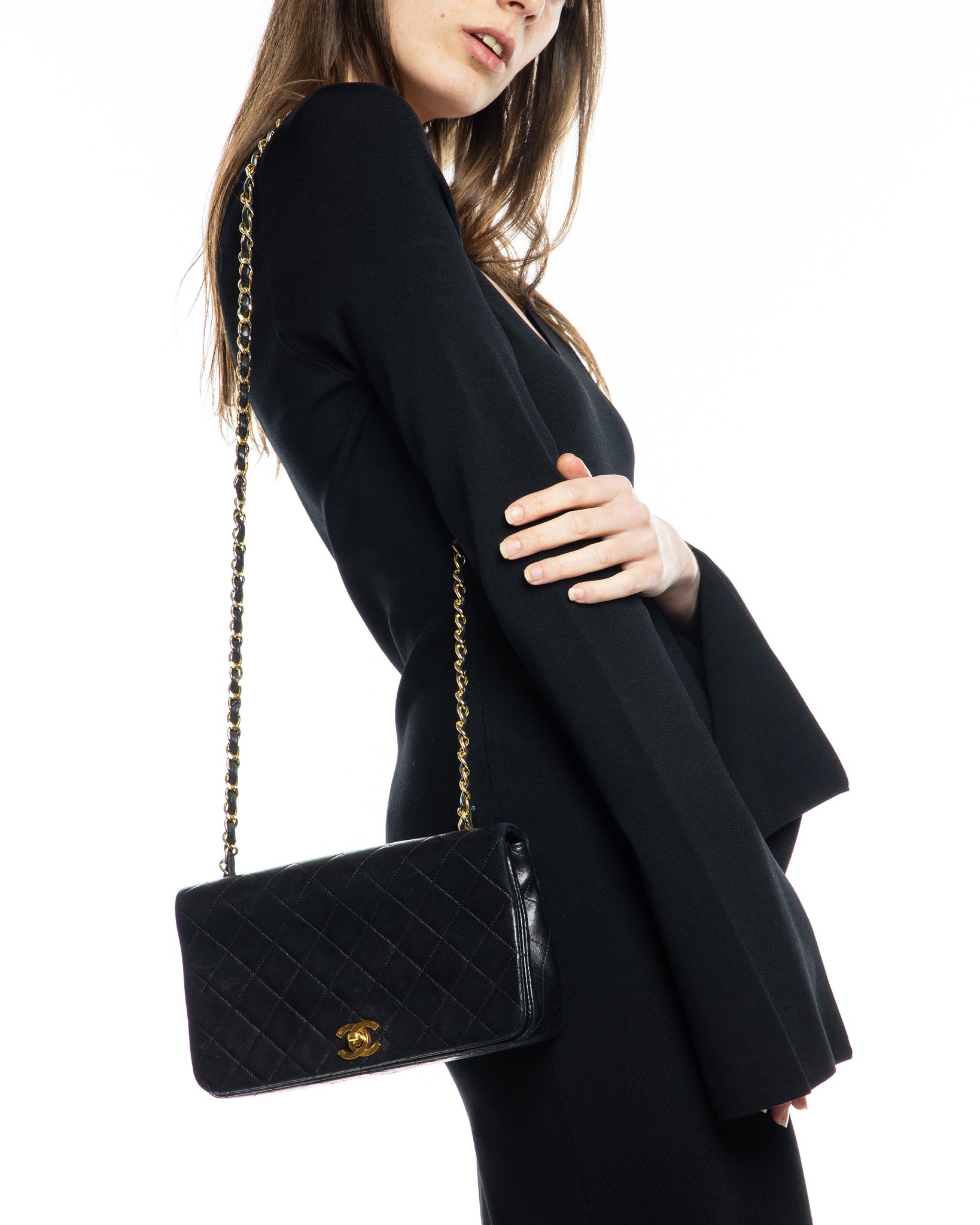 Nass boutique is a multi-brand boutique curating women's clothing and  accessoriesVINTAGE CHANEL BLACK QUILTED FLAP BAG