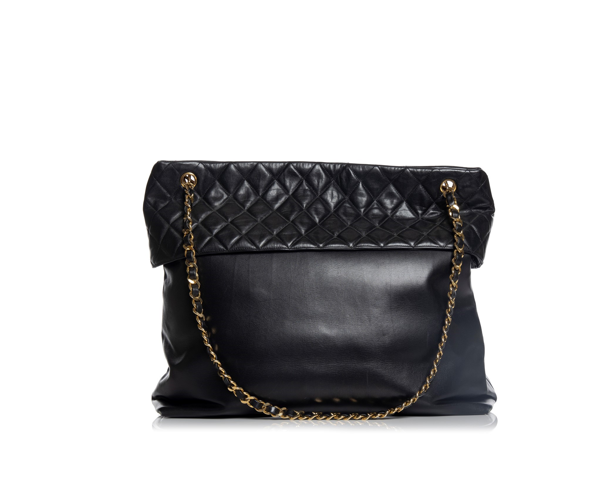 Nass boutique is a multi-brand boutique curating women's clothing and  accessoriesVINTAGE CHANEL LARGE QUILTED TOP BAG