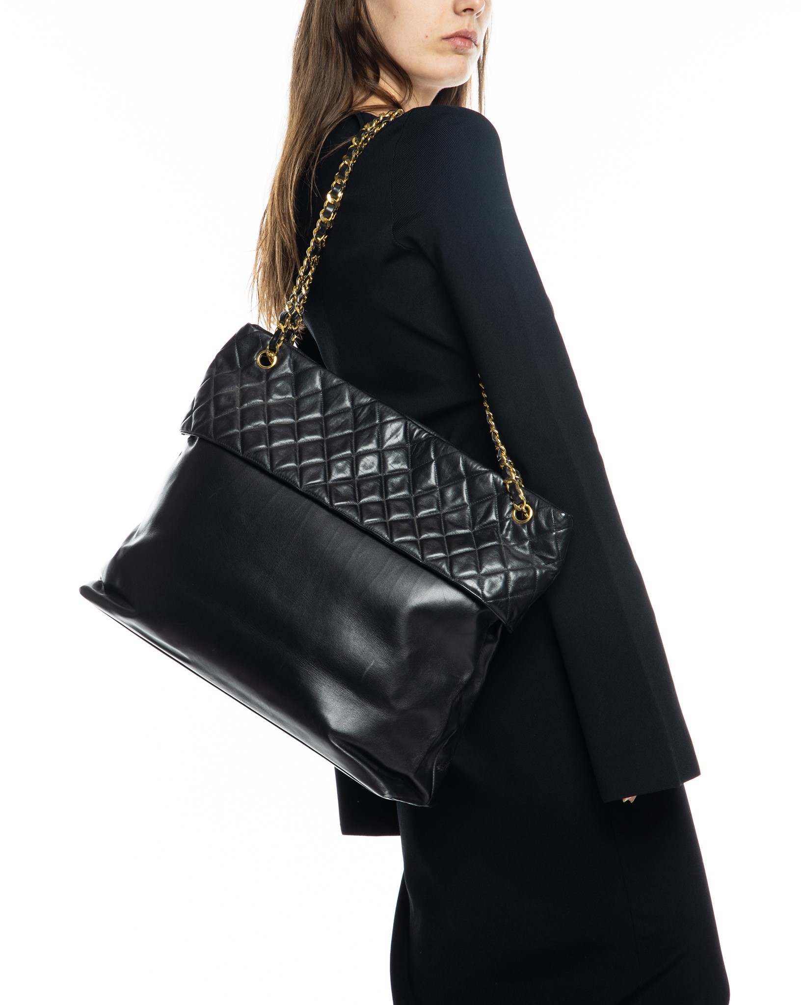 Nass boutique is a multi-brand boutique curating women's clothing and  accessoriesVINTAGE CHANEL LARGE QUILTED TOP BAG